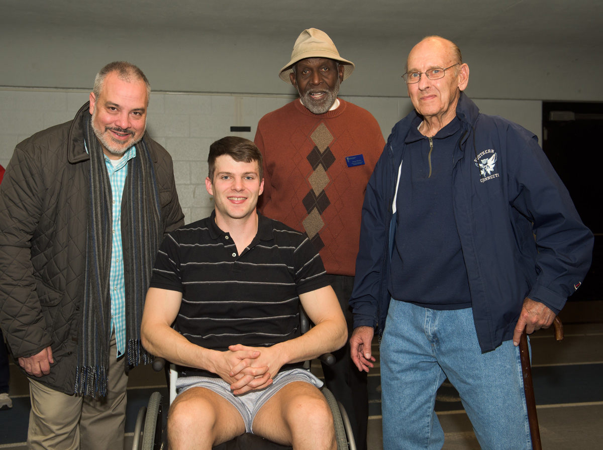 SCSU President Joe Bertolino with Collin Walsh, '08, Jim Barber, and coach