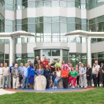 Presenters and attendees of the Material Science and Manufacturing in front of SCSU's science building