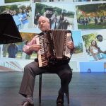 President Joe Bertolino plays the accordion