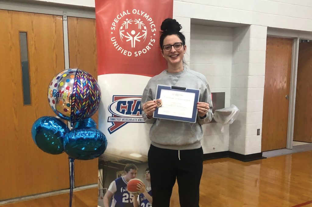 SCSU Jennifer LaCapra holding award certificate from Special Olympics 2020