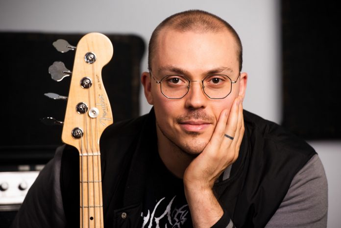 Anthony Fantano with a guitar