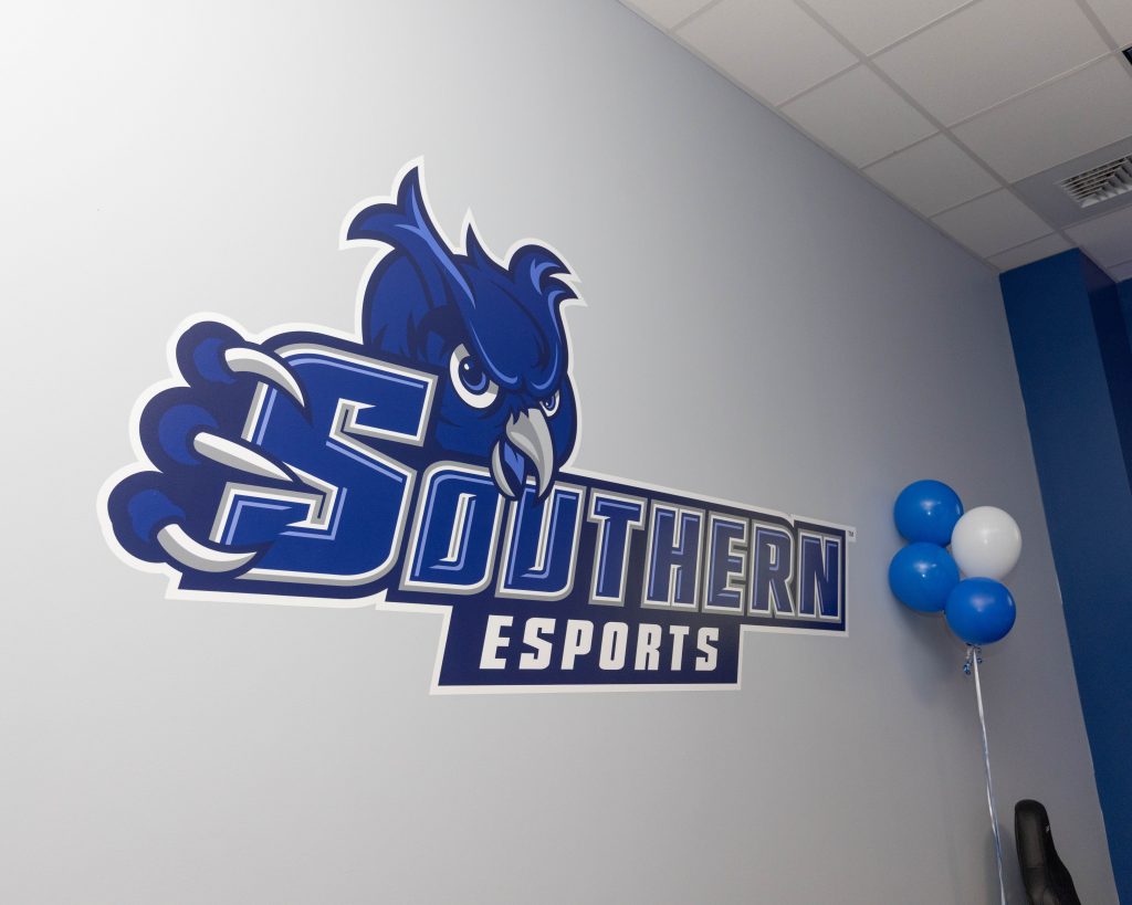 A large wall decal saying Southern Esports with Owl logo 