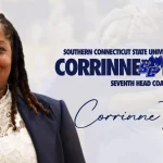 Alt text: Portrait of Corrinne Tarver, newly named head coach of Southern Connecticut State University Gymnastics. She is smiling and wearing a navy blazer over a white lace top. Text on the image reads: "Southern Connecticut State University Gymnastics – Corrinne Tarver – Seventh Head Coach" with the SCSU owl logo between her name. Her signature appears below along with the hashtag #WeAreSC.