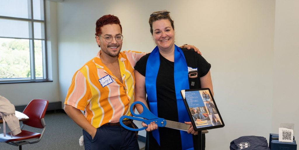 Posing with giant scissors are members of the Honors College team.