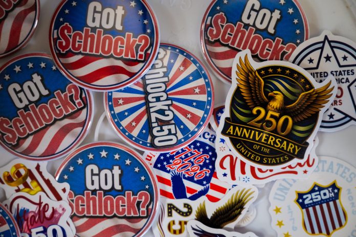 An assortment of red, white, and blue pins and stickers with the message: Got Schlock